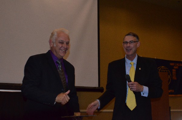 Marc Purcell (r), chapter president, presents Senior Master Sgt. Jerry Taylor, USAF (Ret.), with a Life Member certificate and pin during the chapter's October luncheon.